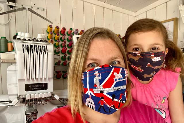 The masks modelled by Jo Darwesh and her daughter.