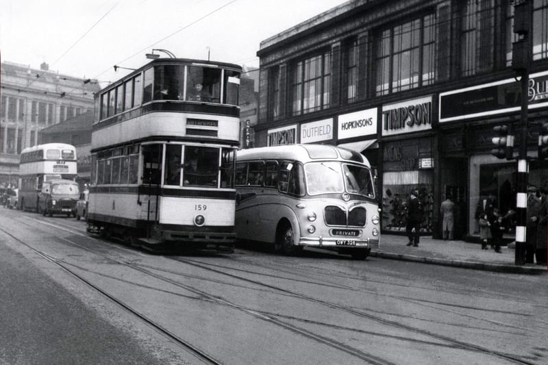 Trams running along a bustling Attercliffe Road, Sheffield in the 1950s