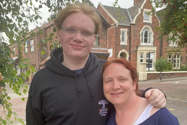 Oliver with his mum, Cheryl, who started a fund raiser