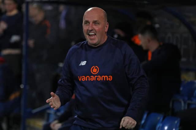 Paul Cook on the touchline against Notts County.