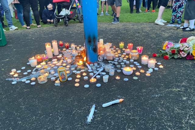 Candles, flowers, and teddy bears were left in Baker Park, Killamarsh, during the vigil on Monday evening