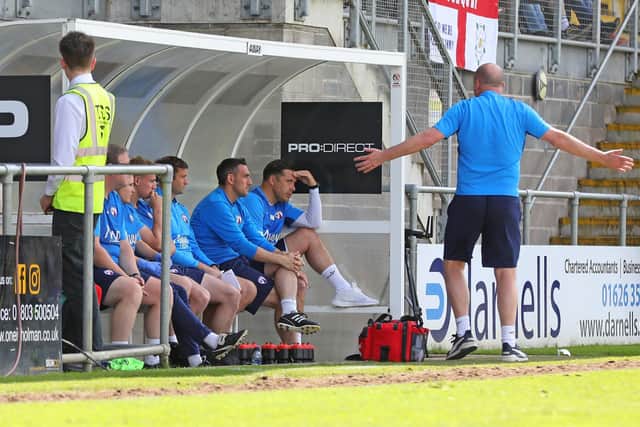 A frustrated Paul Cook on the touchline at Torquay.