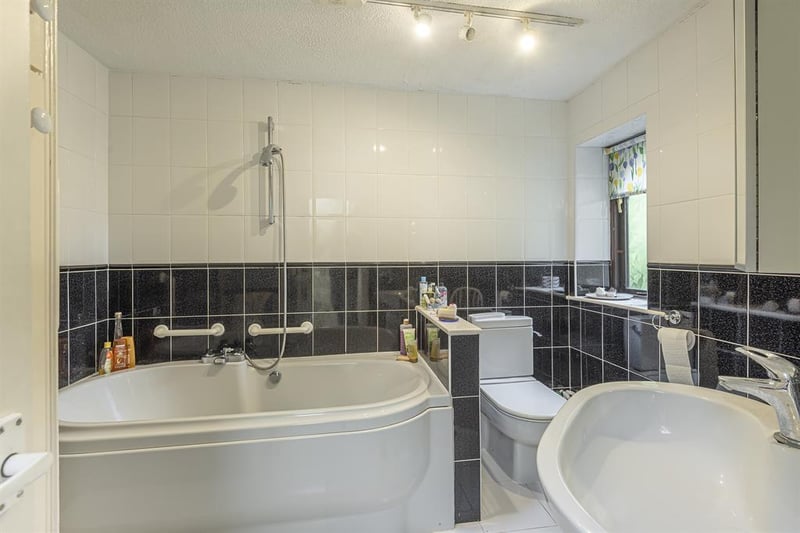 As well as the en-suite shower room, there is a further house bathroom which is fitted with a white suite, complete with a bath and overhead shower.