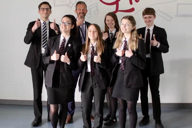 Headteacher Chris Wollard pictured alongside a group of Frederick Gent School students celebrating the recent 'good' Ofsted report