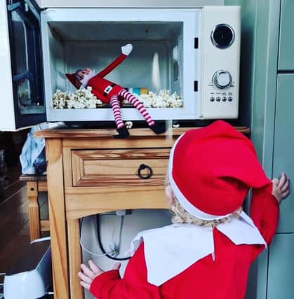 Bubbles the Elf decides to make popcorn with the help of the traditional Elf on the Shelf