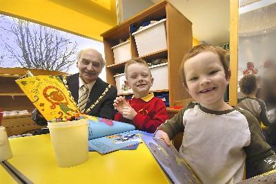 Kyle Treweek, four, and Aaron James, three, enjoy reading lessons with county councillor chairman Walter burrows at Spire Infant and nursery school in 2006