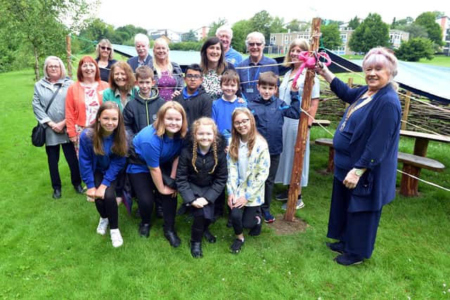 Stonelow Junior School opens forest school area. The seats and canopy has been funded partly by PTA fundraising and partly by Dronfield rotary club donation. Liz Blanshard president of Dronfield Rotary opens the new area. 