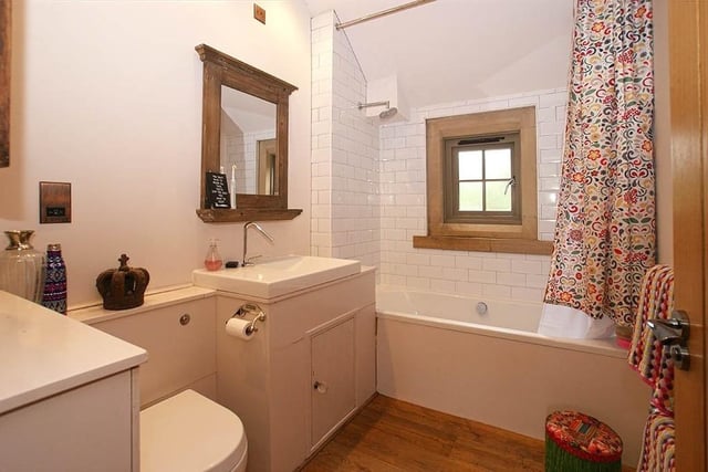 This bathroom serves three of the bedrooms, one of which is next door to it.
