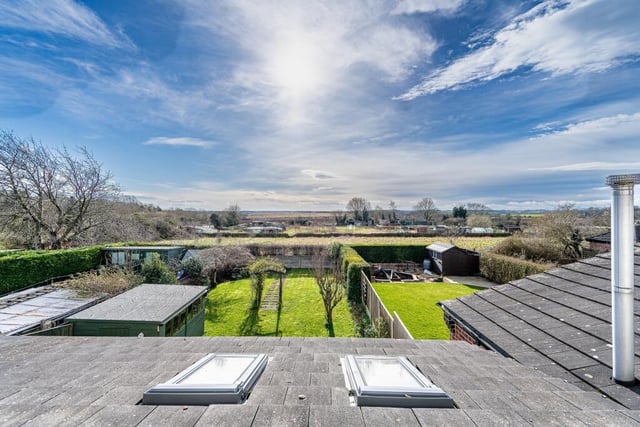 Before we step inside the £185,000 Whitwell house, let's marvel at these superb, sun-drenched views, overlooking open countryside, from the main upstairs bedroom at the back of the property.