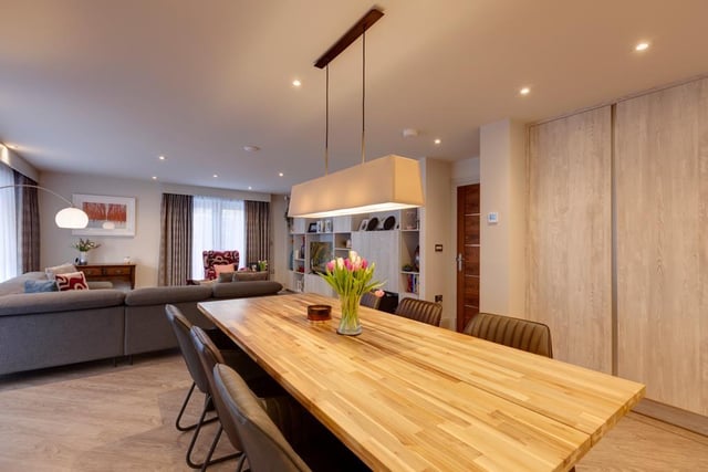 Here's the open-plan living kitchen, with a spacious lounge area and contemporary kitchen/dining area.