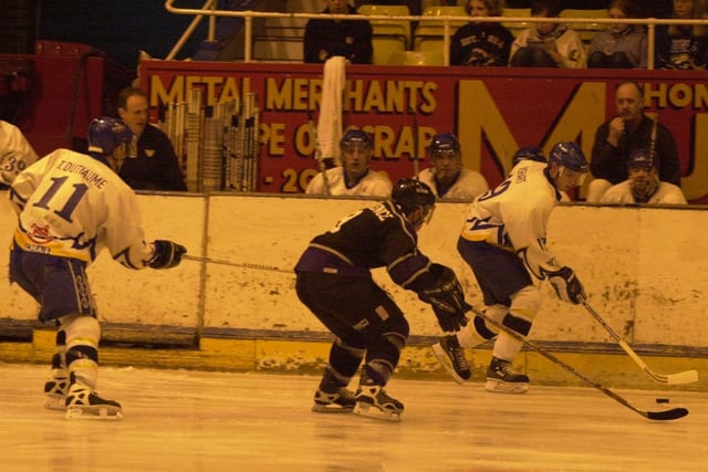 Gary Wishart, icing for Fife Flyers in season 2001-02 in a game versus Coventry Blaze. Also pictured is Todd Dutiaume