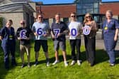 Shane 'PeeWee' Percival, Daz Mosley, Wayne Collings, Kian Mosley and Lynne Shaw, pictured left to right, holding the figures representing the amount handed over to Ashgate Hospice following the Andrew Brookes Memorial Day at Hasland Club.