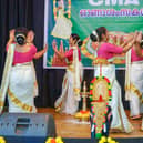 On the stage with a traditional dance performance. Dances like the Kathakali and Mohiniyattam are normally performed during Onam