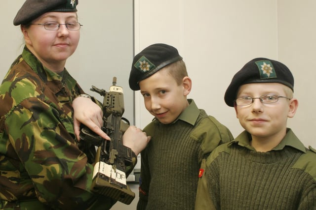 Army cadets looking at equipment at the opening of the new cadet centre Clay Cross in 2006   l to r  Barbara Scullion, Nathan Dovinson 12yrs.Ben Parker 13yrs.