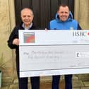 Martin Bruno (left) and Claire Wood of Woodall Homes present the cheque to Richard Stevenson, head of sport at Barlborough Hall School