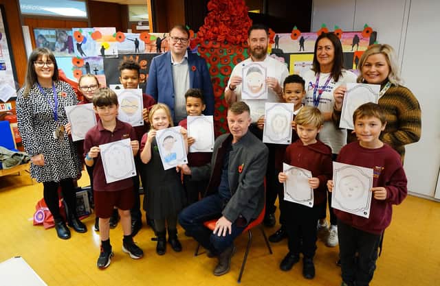 Arts Event at Arkwright Primary School. Pupils with art drawings seen with Steve Wells, school governor, Teacher Rebecca Roland, arts lead and organiser, Leigh Allwood Ashgate hospice commuity fund raiser, MP Mark Fletcher and Richard Shaw from Bolsover Castle.