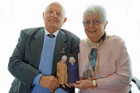 Wirksworth residents Harold and Wendy Allsobrook with their anniversary card from the King and Queen. (Photo: Brian Eyre/Derbyshire Times)