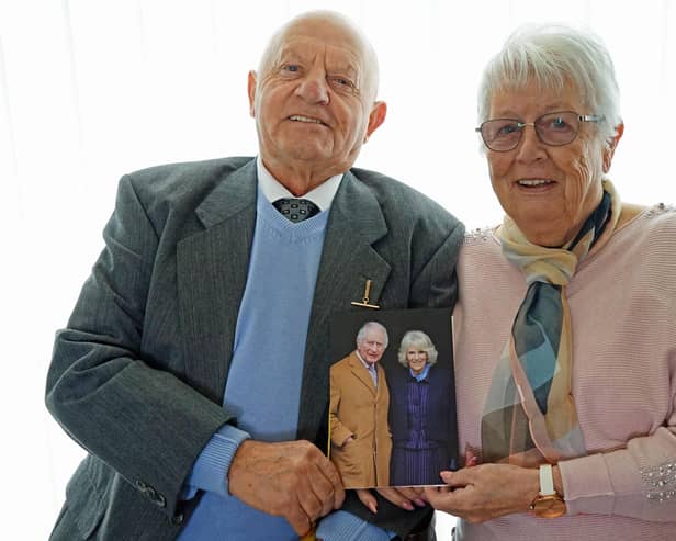 Wirksworth residents Harold and Wendy Allsobrook with their anniversary card from the King and Queen. (Photo: Brian Eyre/Derbyshire Times)
