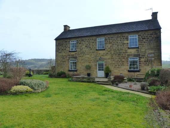 The farmhouse, which has outbuildings, land and gardens extending to 12 and a half acres, is on the market for £995,000.