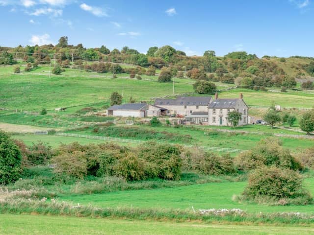 The freehold farmhouse  with a range of outbuildings and 7.52 acres of land welcomes offers in excess of £1.2million.