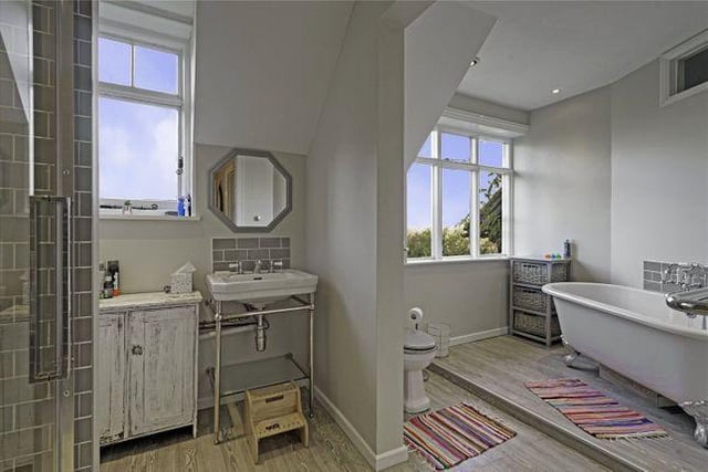 The family bathroom is located on the first floor and contains a freestanding bath with shower, WC and wash basin, while also offering outstanding views across the garden.