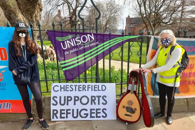 Chesterfield Stand up to Racism members Megan Taki, left, and Barbara Sansome with the lute at a recent demonstration near the Crooked Spire.
