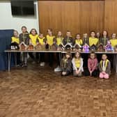 Girls from the 1st Holme Hall and 3rd Brampton Brownies with their 'stable decorations'