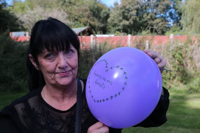 Jane Allen releases balloons to honour her brother Phillip.