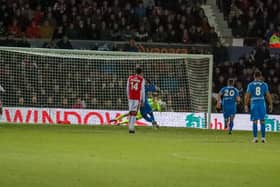 Kabongo Tshimanga saw his penalty saved by Wrexham goalkeeper Rob Lainton.