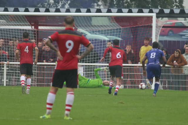 Ross Durrant saves Ricardo Fuller's penalty. Pic by Lee Hewitt.