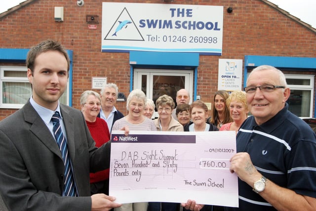 Michael Beddingham and Charlene Wilson from New Whittington Swim School presented a cheque to Alan McConville from DAB Sight Support in 2007.