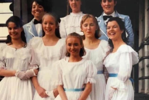 Kate Viles, second left on the middle row,  performed her first show, Carousel when she was just 12 years old.