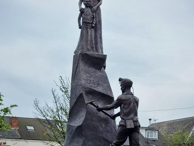 The statue is the work of sculptor, Peter Walker. It stands in the market place.