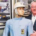 Rob Arnold with the Sir Stirling Moss racing suit which he is selling.