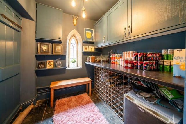 The pantry, which is off the living room, offers ample space for drinks storage or a mini bar.