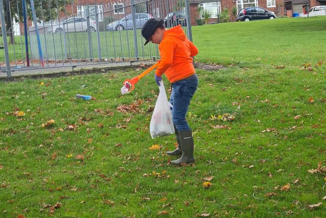Henry Theobald, 8, has been cleaning up his local park