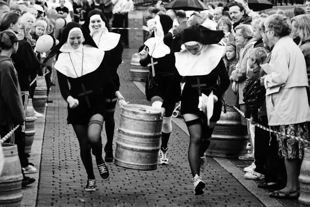Pub teams competing in the Ripley barrel race. Do you which pub team dressed as nuns and when this photo was taken?