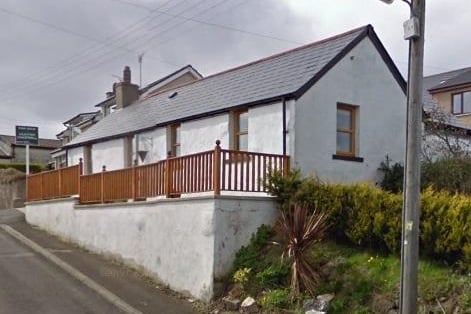 This three-bed cottage, on the market for £149,950, boasts sweeping views of Whitehead and Belfast Lough.  Agent: Hunter Campbell