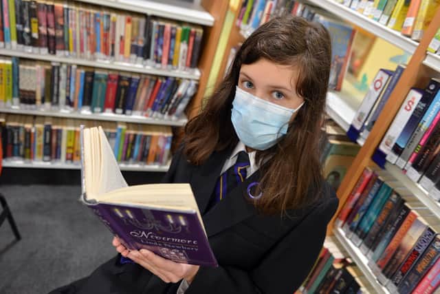 Lola Sinfiel, a pupil at at Outwood Academy Hasland Hall, reading the in library