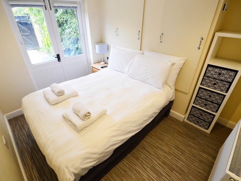 The room could be used as a second reception room as the double French doors open out on to the large forecourt.