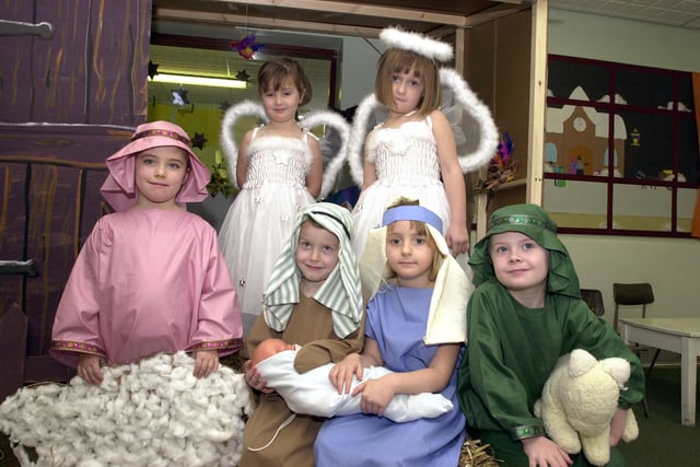In 2001 Moorends West End Primary School pupils presented three Christmas plays. Reception pupils presented the Nativity, older keystage 1 children took part in Starlight, a modern interpretation of the Christmas story, and keystage 2 pupils took part in Christmas Around the World. Our picture shows nativity players, back row, angels Megan Russell and Mina Whitely, both aged four, front row, shepherd Robyn Lindley, aged five, Joseph, Lewis Isle, Mary, Nicolas Stead, both aged four, and shepherd Samuel Cairns, aged five.
