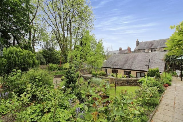The property has pretty gardens containing lawned areas and a patio.