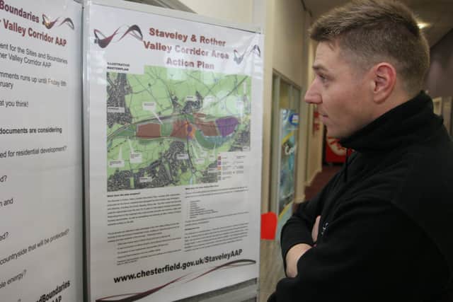 Dean Mayfield looks over the Staveley works site plans during an event in 2021.