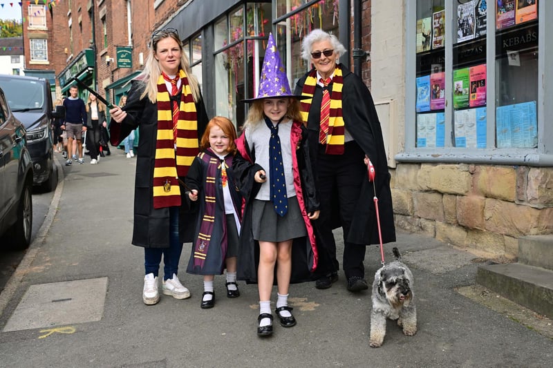 Visitors with Hogwwarts scarves and wands at the ready