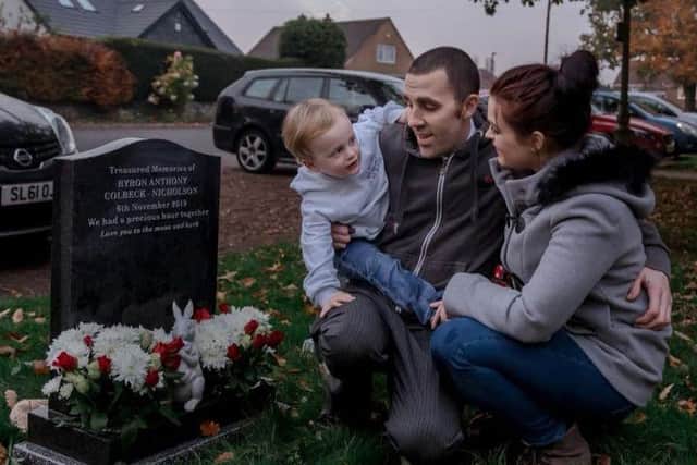Chloe,  Roger Nicholson and their son Eli at Byron's final resting place.