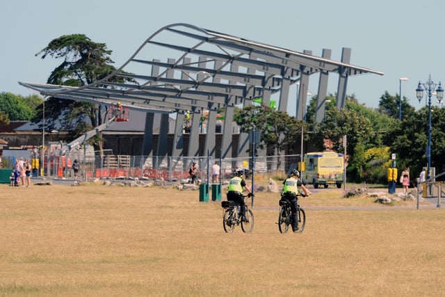 Police officers ride bikes on Southsea Common on the hottest day of the year. Picture: Sarah Standing (250620-4979)