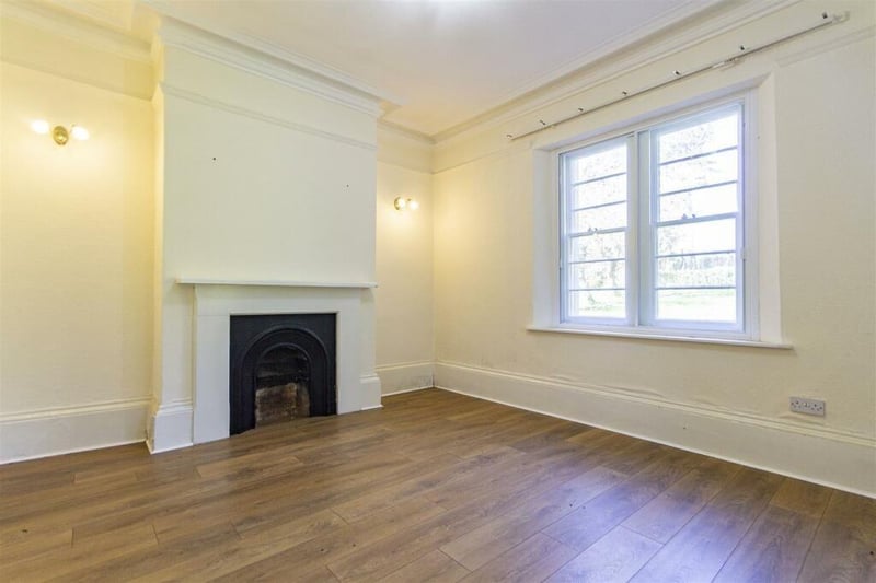 Original coving and picture rail are features of this good sized reception room which has an eye-catching fireplace.