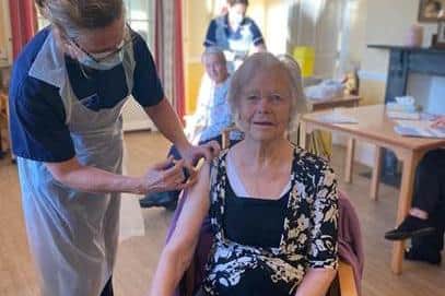 Resident Mona receives her Covid vaccine at the Old Vicarage Care Home in Clay Cross