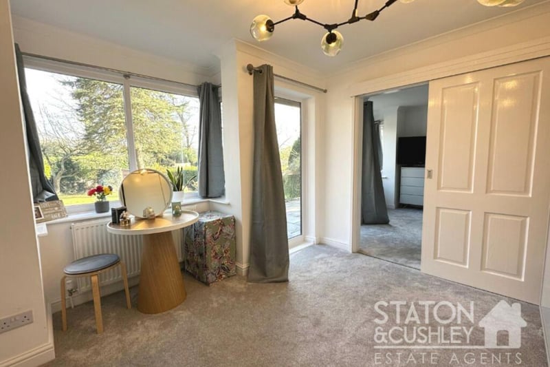 This walk-in dressing room is attached to the master bedroom. It features a door opening out on to the back garden