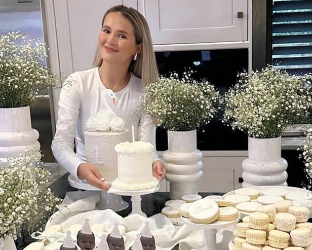 Molly Mae uploaded a photo on Instagram, with the macarons clearly visible in the background, gushing over her little girl as they celebrated her big day.